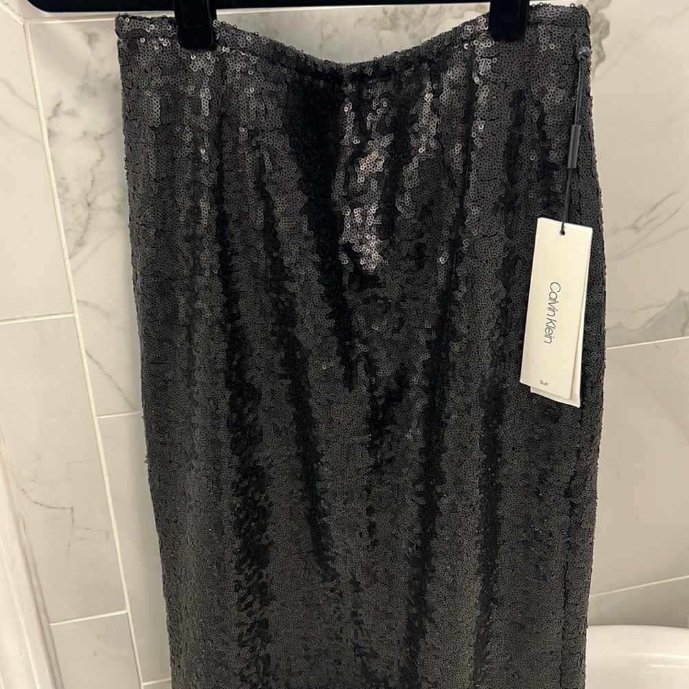 Calvin Klein sequin black skirt. NWT. Size 4.